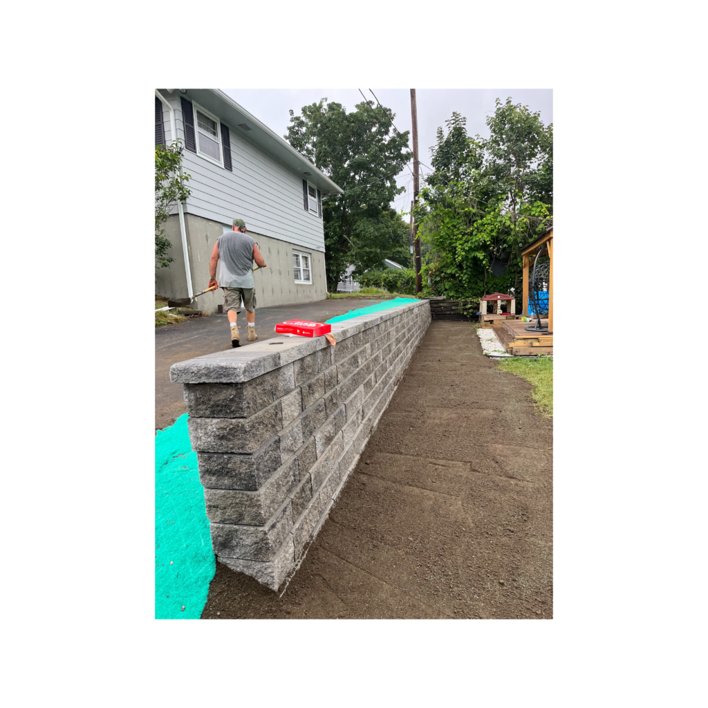 Almost-completed-retaining-wall-with-worker